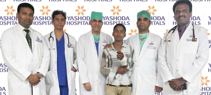 Hand of factory worker replanted 